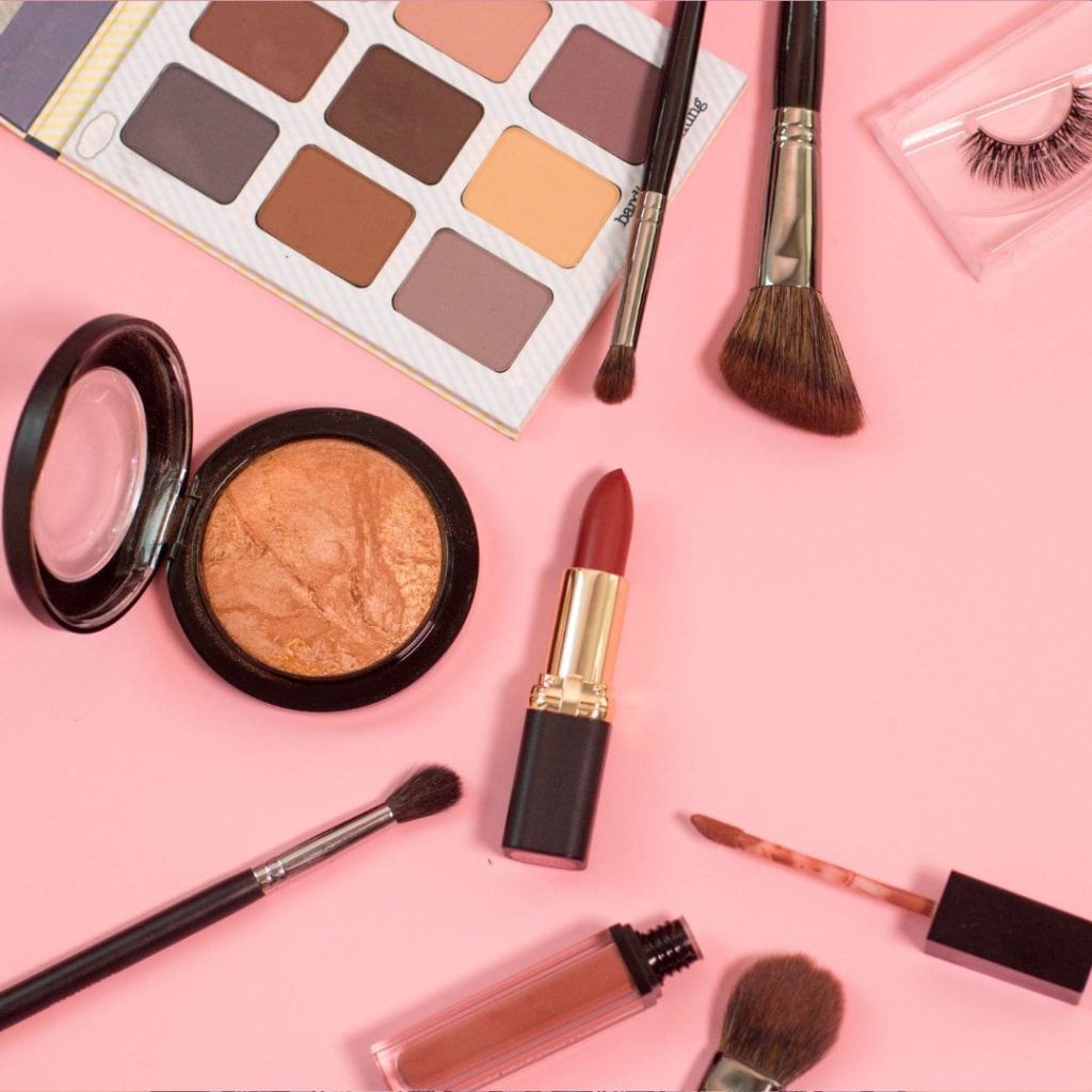 Photography of a range of cosmetics laid out in no particular order