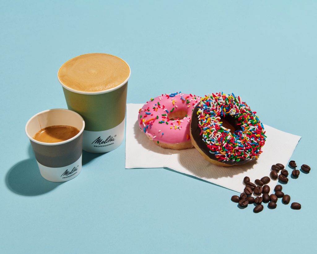 Styled photo of Melitta coffee next to donuts